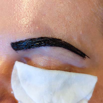Photo of eyebrows being tinted